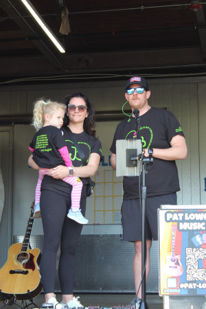 Kate, Maddie, and Ben White on stage